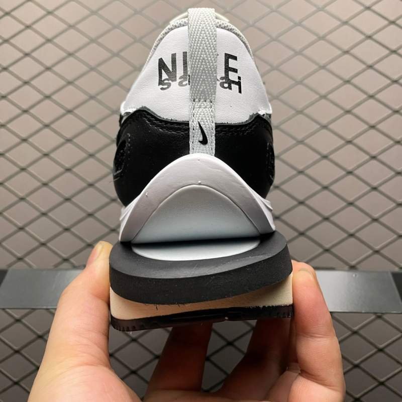 1742778732 490 Nike sacai x nk vapapaffle 30 black and white bneakers
