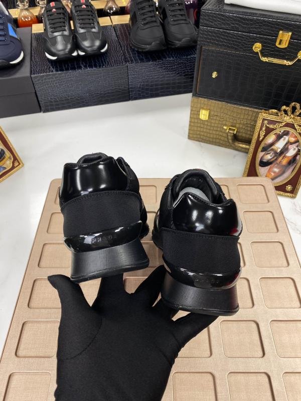 1749460875 26 Damped black sneakers for men from Prada