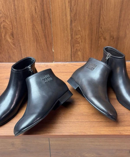 MiuMiu's new FallWinter 2025 collection features retro British-style distressed, rubbed-color block-heeled ankle boots (2)